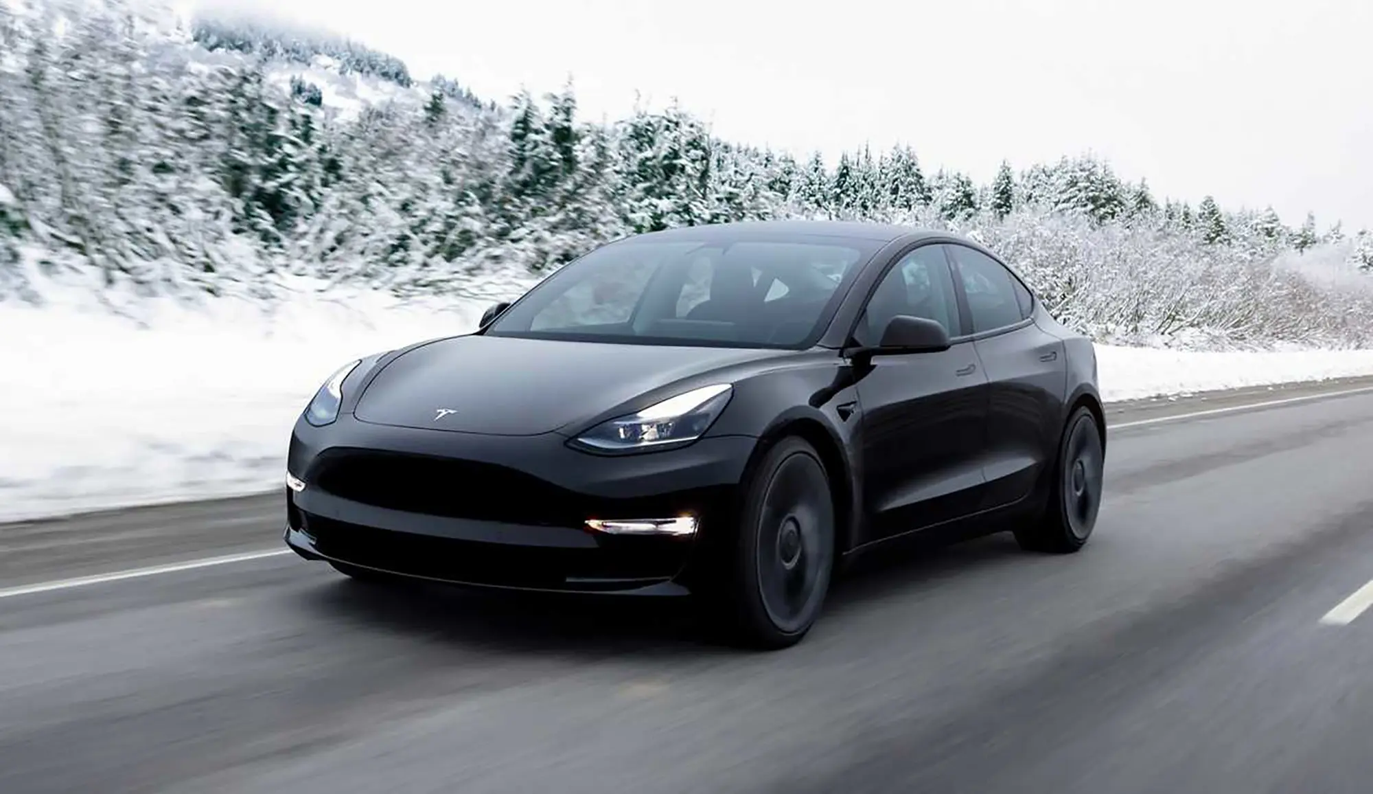 Tesla drive on road in Winter