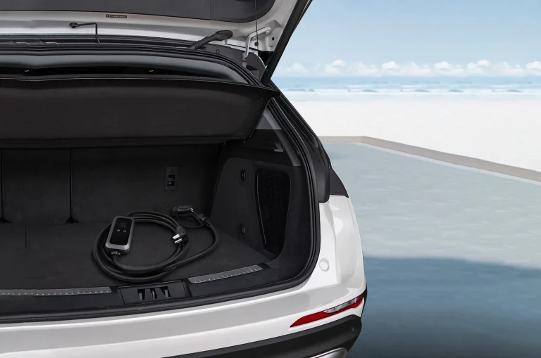 Portable EV charger neatly stored in the trunk of an electric vehicle