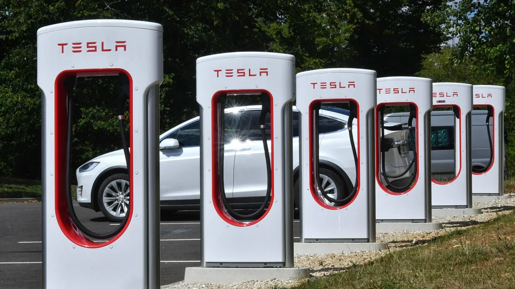 Tesla and other DC fast chargers in a row showing the importance of OCPP compatibility