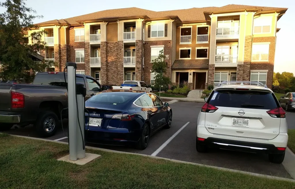 EV charger connected to a glowing futuristic charging station symbolizing OCPP’s evolution