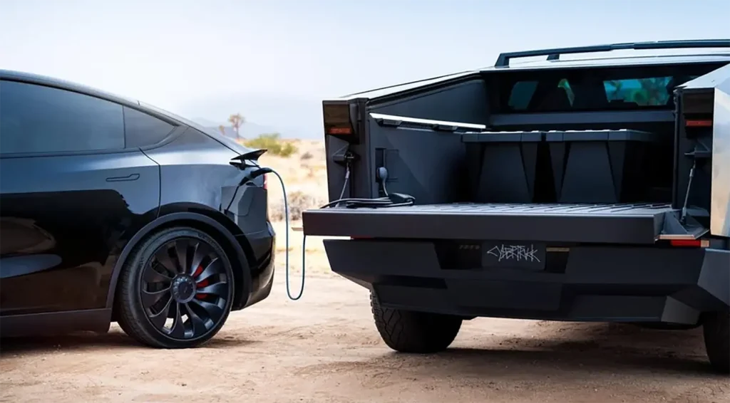 Tesla Cybertruck charging another EV using V2V bidirectional EV charger in the desert