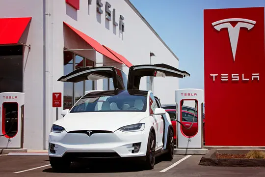 Tesla Model X charging at Supercharger station — DC fast charging