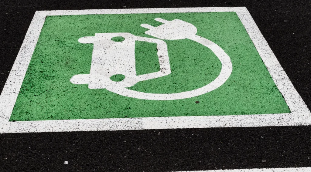 Green EV charging lane marking used for wireless charging-ready parking areas