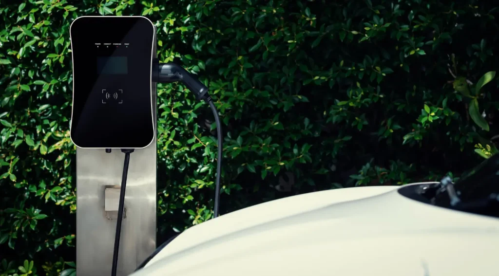 J1772 EV charger connected to vehicle showing charging power rate