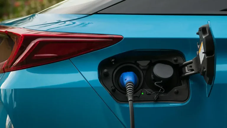 do hybrid cars need to be charged plug-in hybrid charging port close up