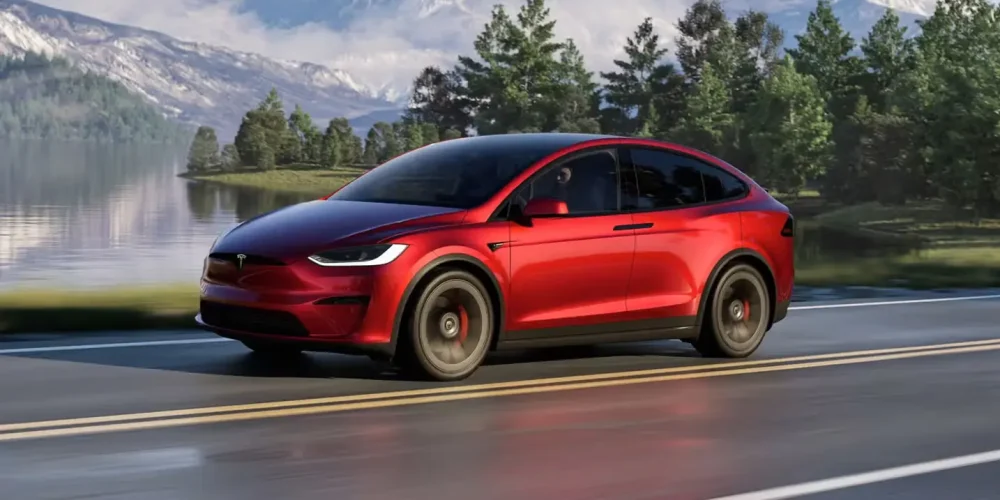 Tesla Model X driving by the lake — How to Charge a Tesla Model X