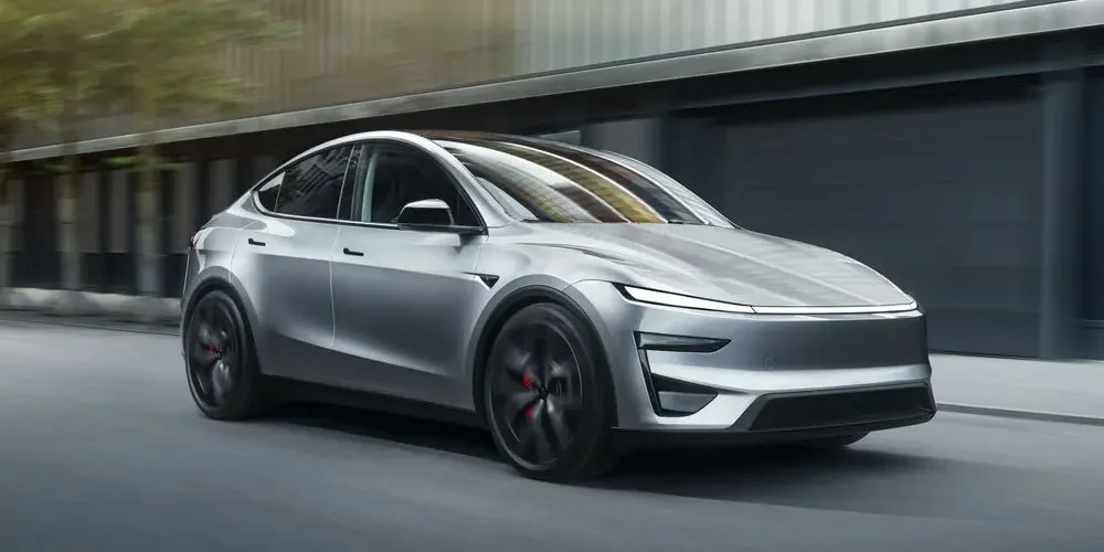 Tesla Model Y driving on the road, illustrating How to Charge Tesla Model Y guide