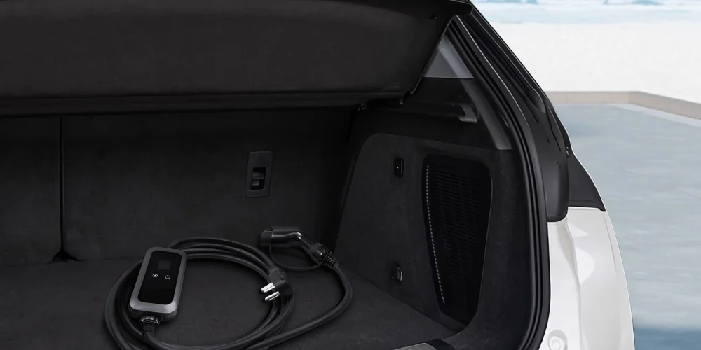 Portable EV charger neatly stored in the trunk of an electric vehicle
